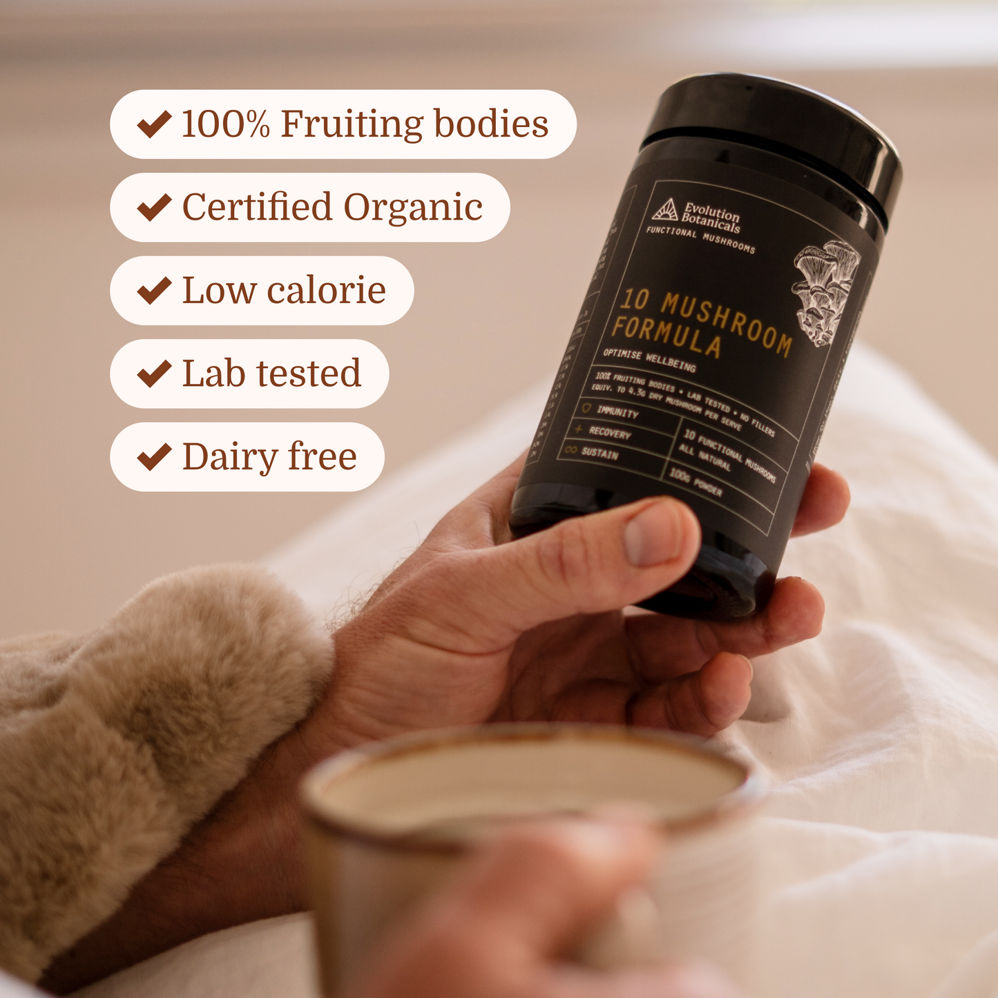 man holding 10 mushroom formula in bed