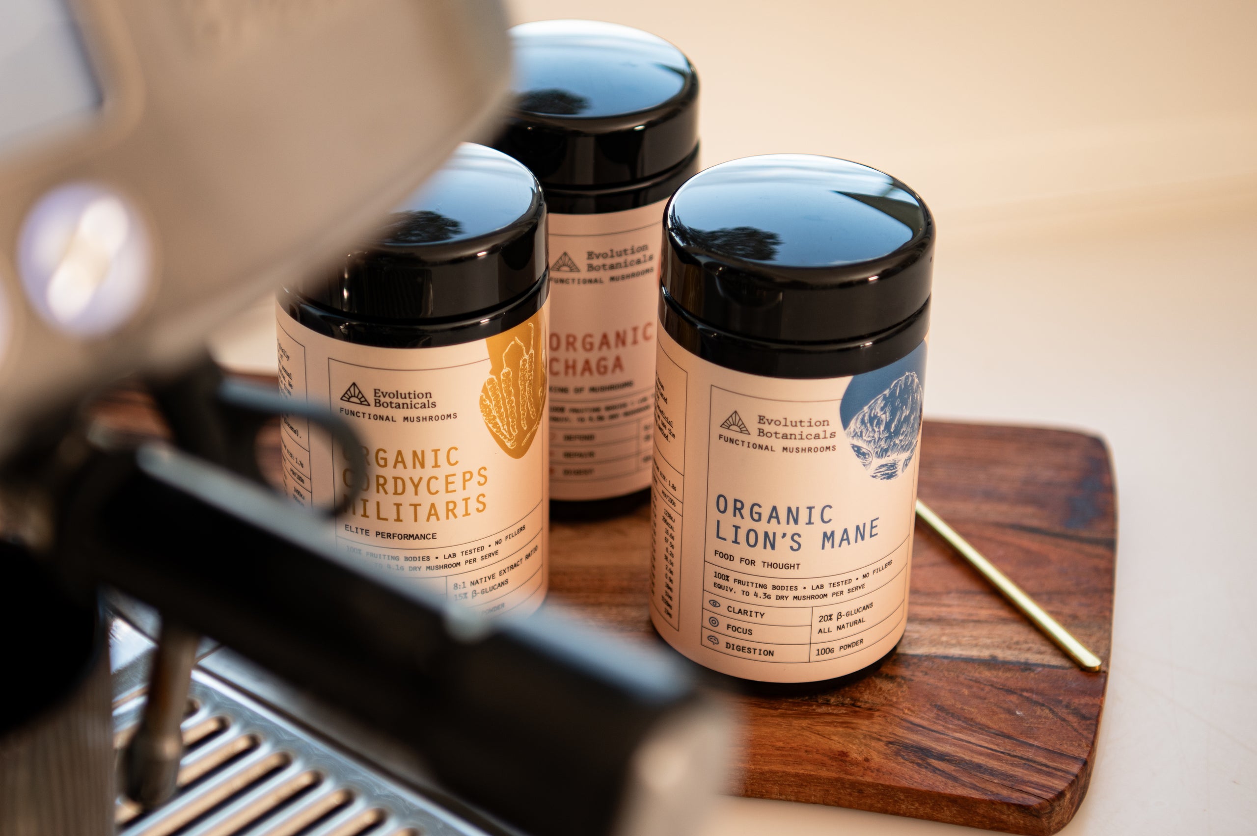 A closeup photo of 3 jars of Evolution Botanicals range, including Organic Lion's mane, Organic Chaga, and Organic Cordyceps Militaris