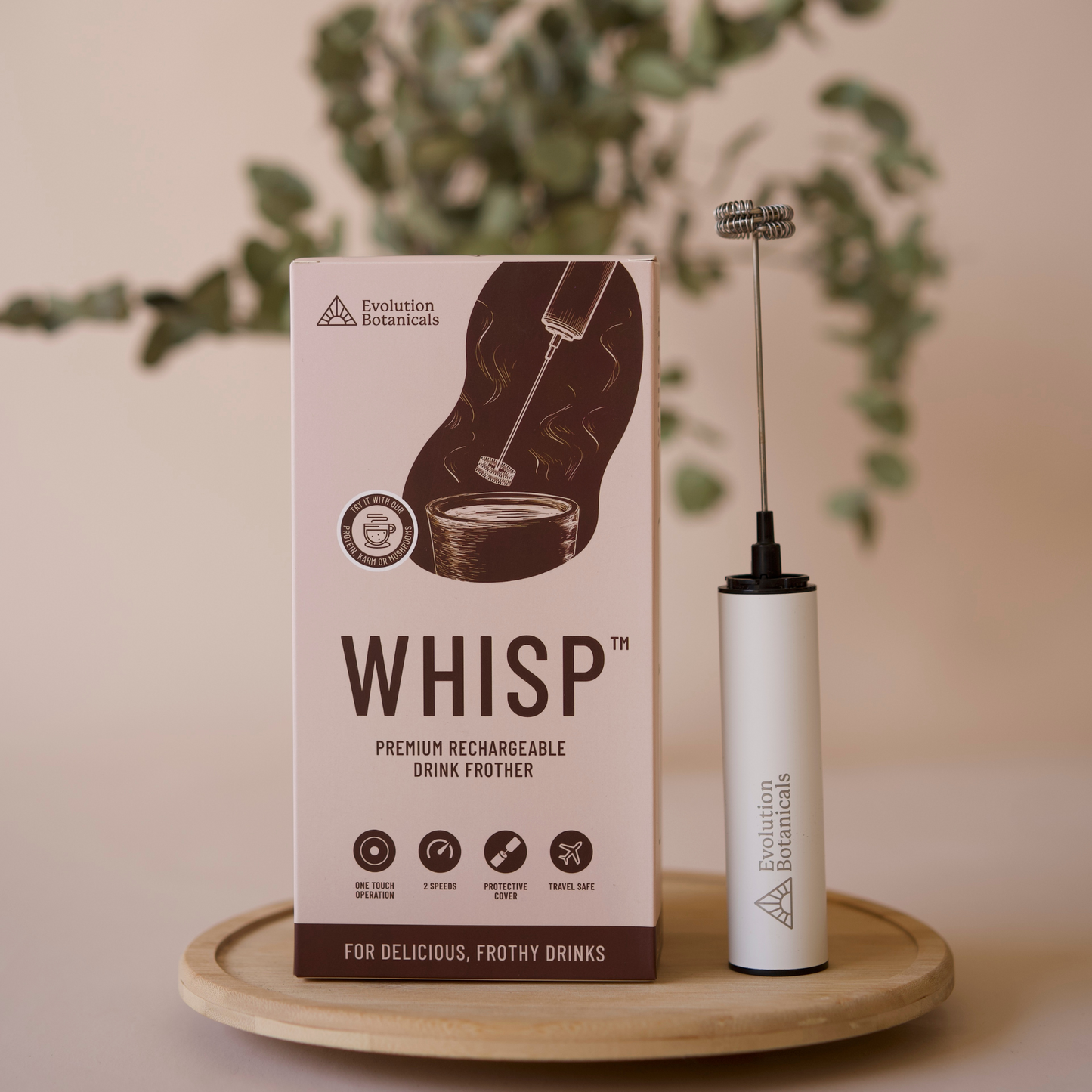 A image of the Whisp Drink Rechargeable Frother next to its box