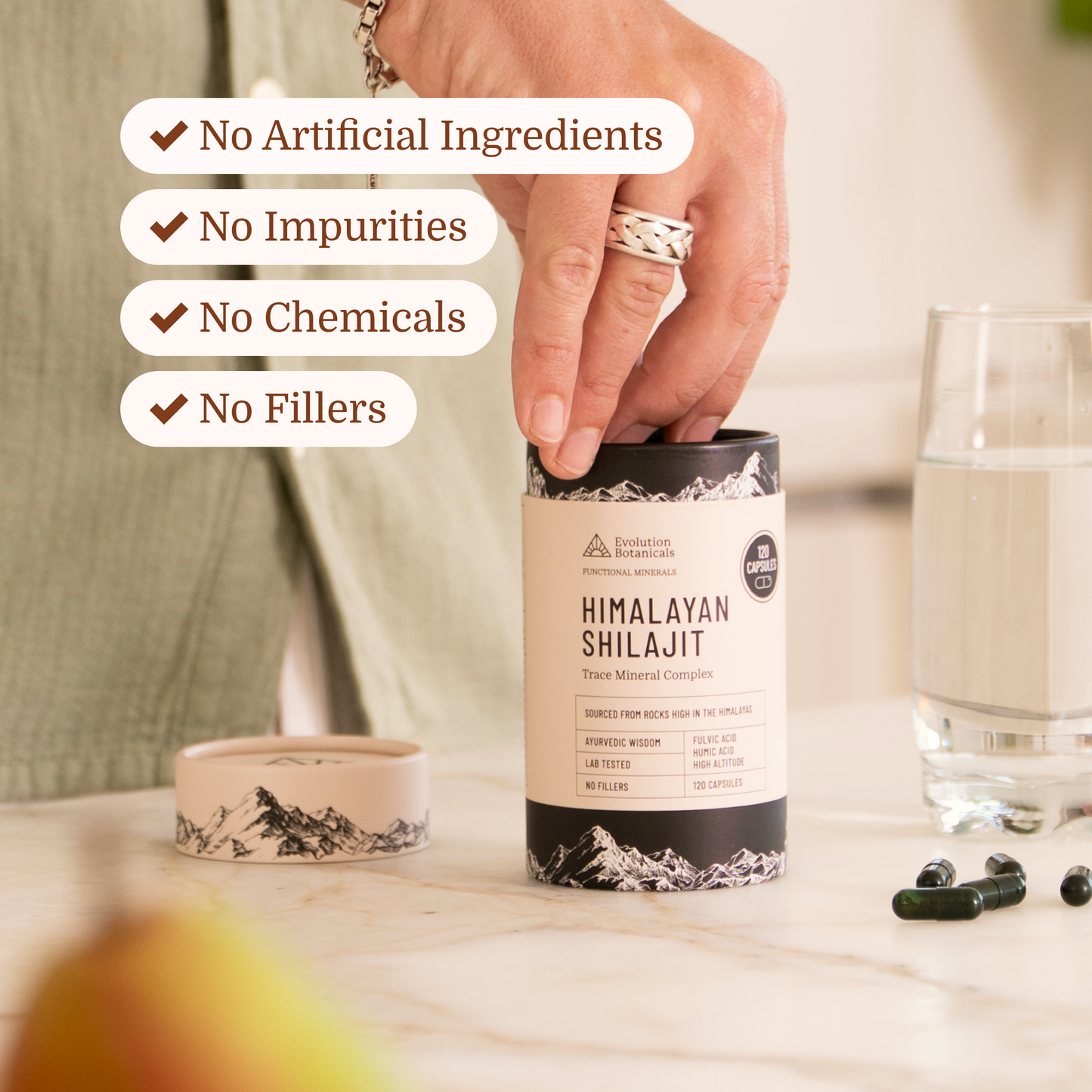 himalayan shilajit capsules getting picked out of its tube