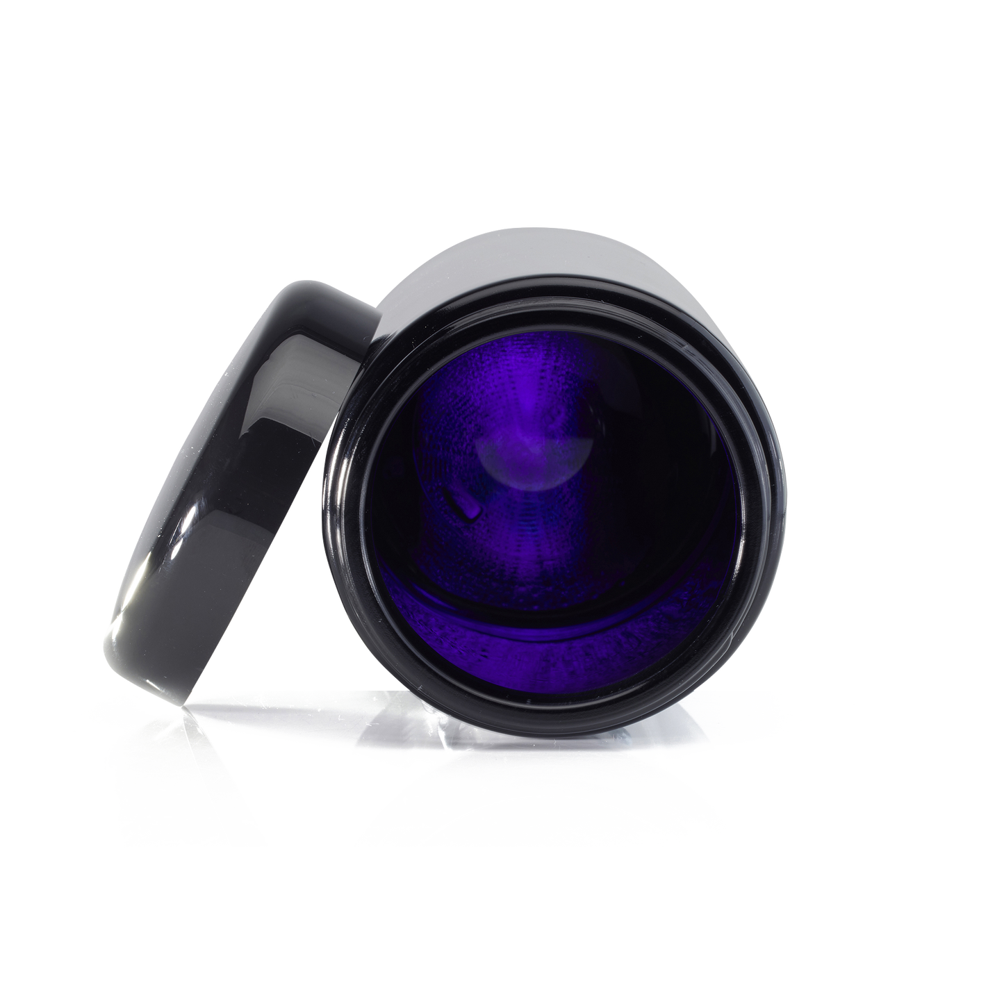 Photo of what the inside of a Miron glass jar looks like, with a violet tint of light showing through the glass