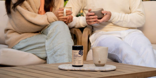 People sitting outside having a warm drink with some Ashwagandha  in it 