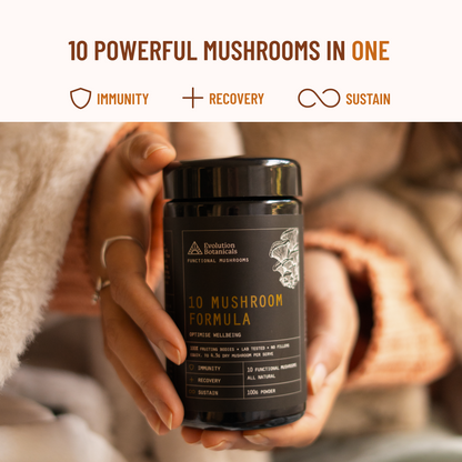 Women holding the 10 mushroom formula with 2 hands 